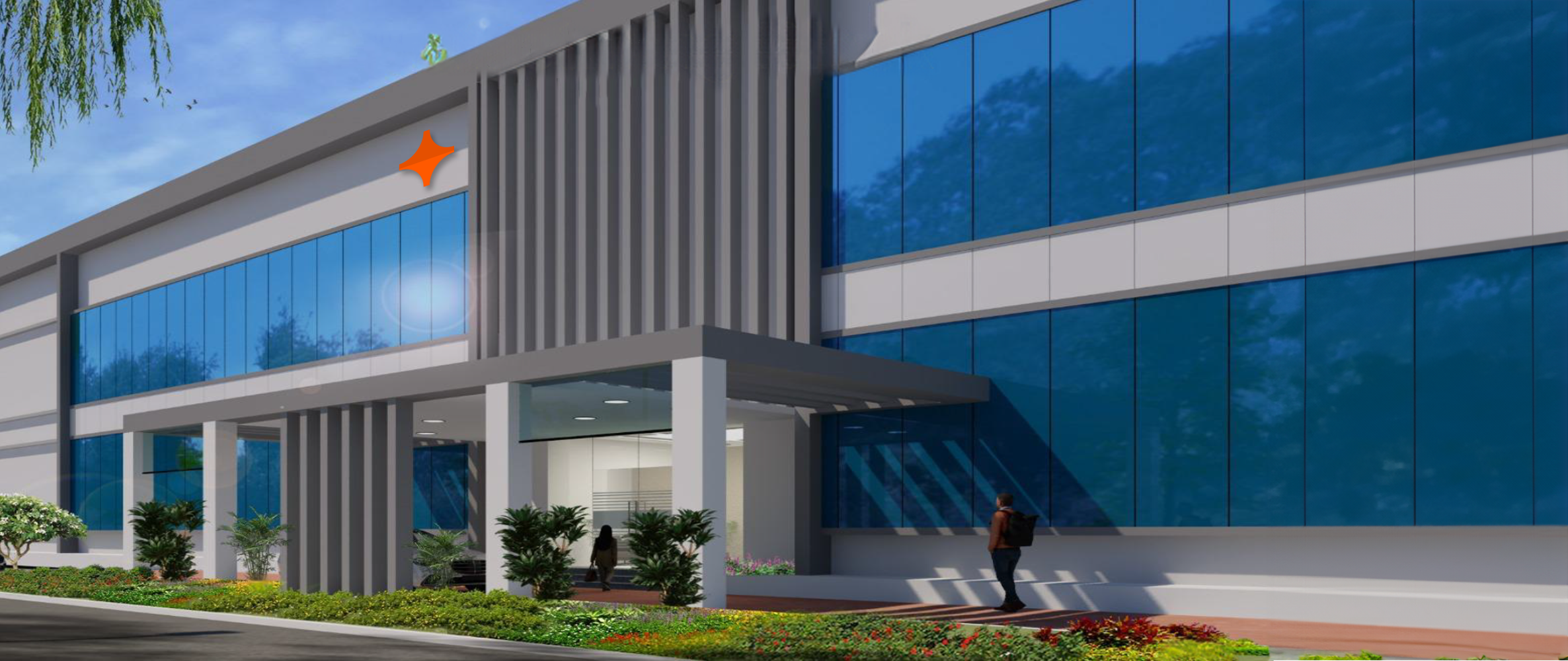 Front view of Falcon's manufacturing facility entrance with large glass windows and modern landscaping.